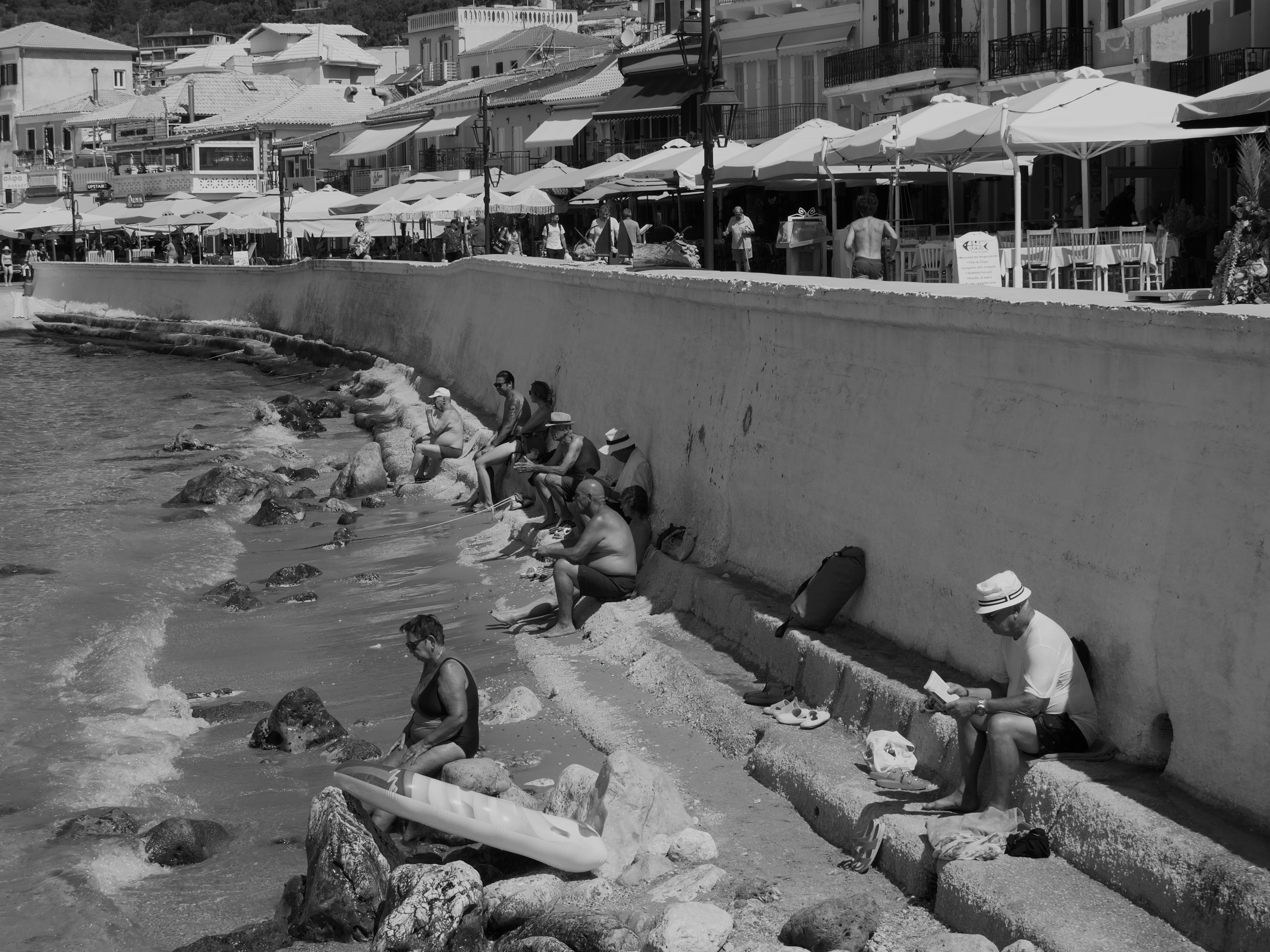 Photo of people sitting by the beach